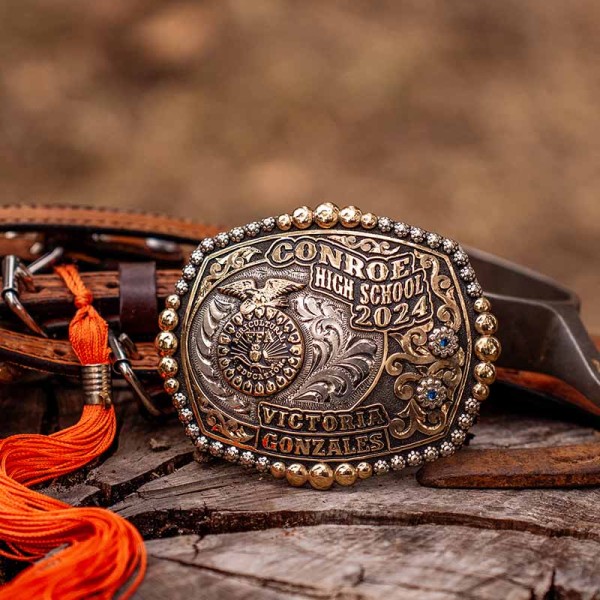 A custom graduation belt buckle for Conroe High School 2024 with personalized name featuring the Future Farmes of America logo